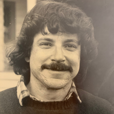 A photo of Steven M. Wise (a white man with dark hair, a mustache, and a relaxed, confident smile) as a young lawyer.